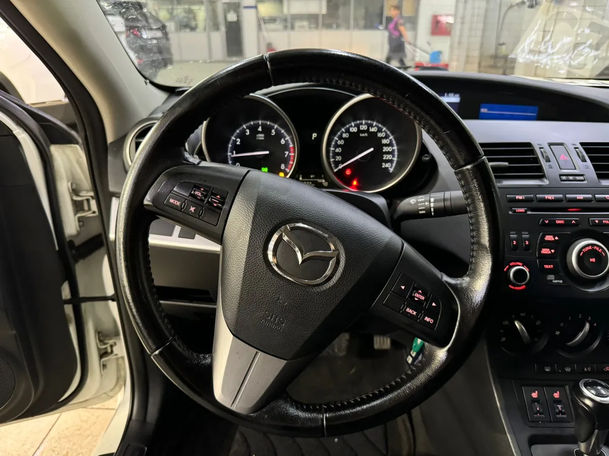 Mazda 3 1.6 AT (104 л.с.)